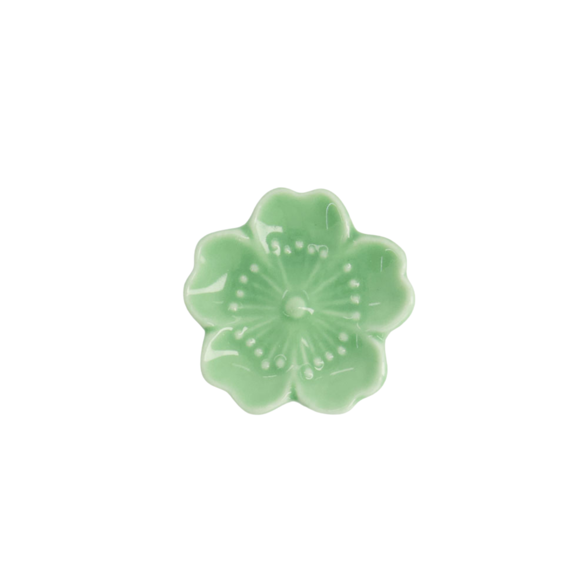 porseleinen groene eetstokjeshouder in de vorm van een sakura bloem